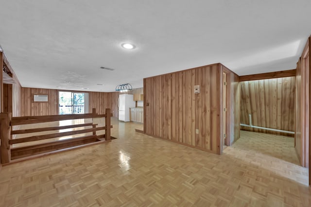 17230 Pioneer Trl, Conroe, TX 77302 - unfurnished living room featuring wood walls and recessed lighting