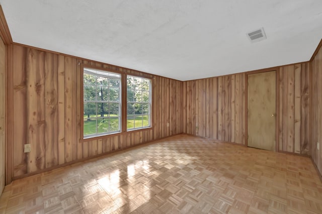 17230 Pioneer Trl, Conroe, TX 77302 - spare room featuring wood walls