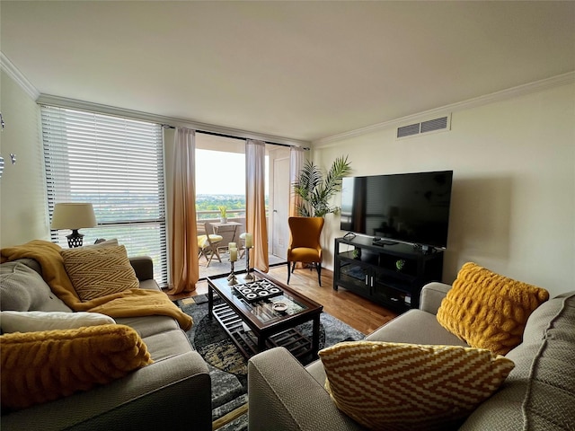 3525 Sage Rd Unit 1502, Houston, TX 77056 - living room featuring ornamental molding, wood finished floors, and a wall of windows