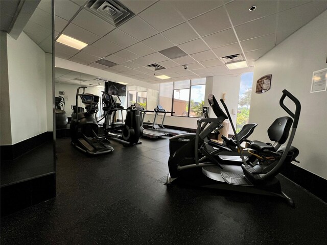 3525 Sage Rd Unit 1502, Houston, TX 77056 - workout area with baseboards and a drop ceiling