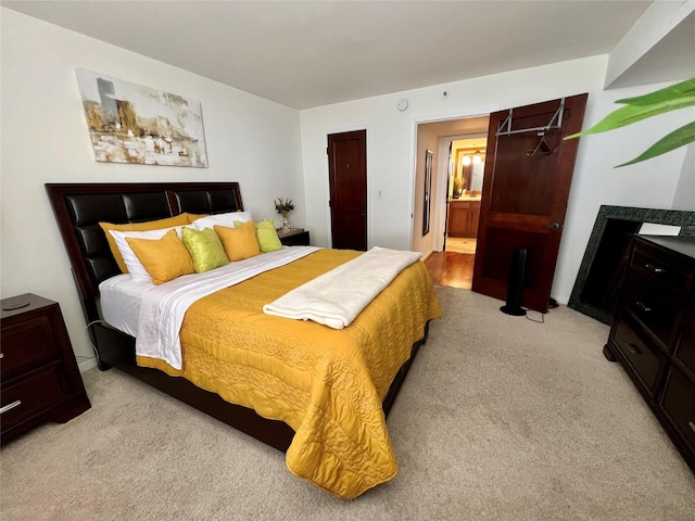3525 Sage Rd Unit 1502, Houston, TX 77056 - bedroom with light carpet and ensuite bath