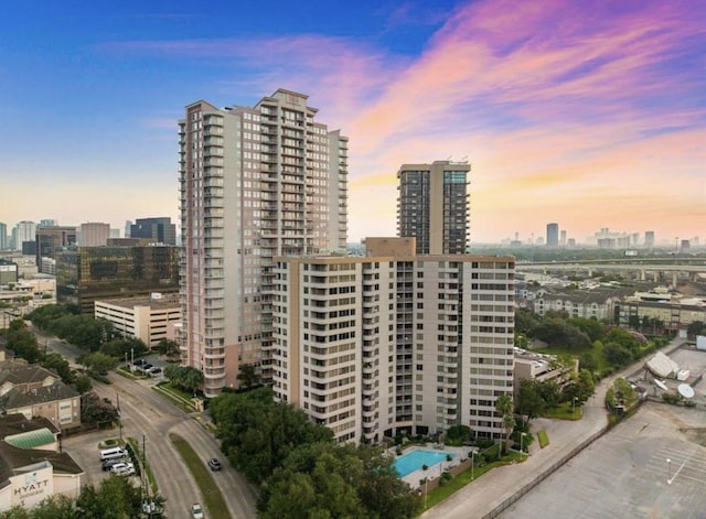 3525 Sage Rd Unit 1502, Houston, TX 77056 - property at dusk with a view of skyline