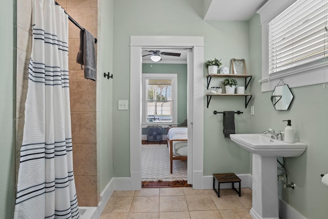 2413 34th St, Galveston, TX 77550 - ensuite bathroom with a tile shower, a ceiling fan, tile patterned floors, and crown molding