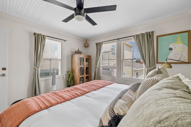 2413 34th St, Galveston, TX 77550 - bedroom with ornamental molding, cooling unit, multiple windows, and a ceiling fan