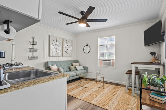 2413 34th St, Galveston, TX 77550 - living area featuring crown molding, cooling unit, a ceiling fan, and wood finished floors