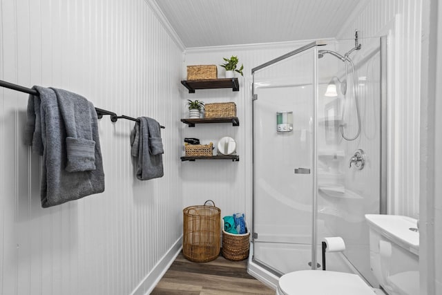 2413 34th St, Galveston, TX 77550 - bathroom featuring ornamental molding, wood finished floors, and a shower stall