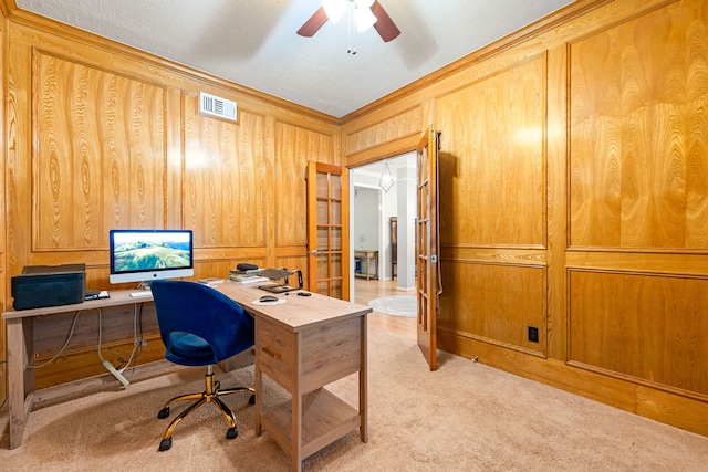 6 Heathstone Pl, The Woodlands, TX 77381 - home office with light carpet, wood walls, a ceiling fan, and crown molding