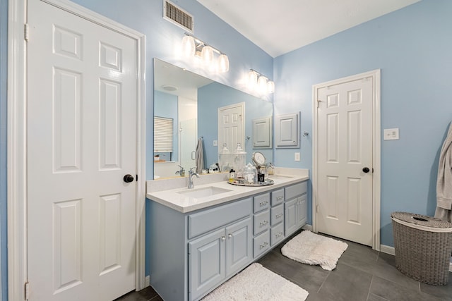 6 Heathstone Pl, The Woodlands, TX 77381 - bathroom featuring double vanity and baseboards