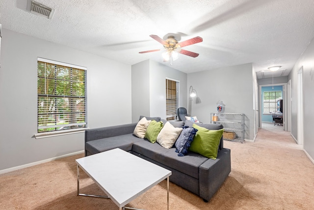 6 Heathstone Pl, The Woodlands, TX 77381 - living area with attic access, light carpet, a ceiling fan, and a textured ceiling