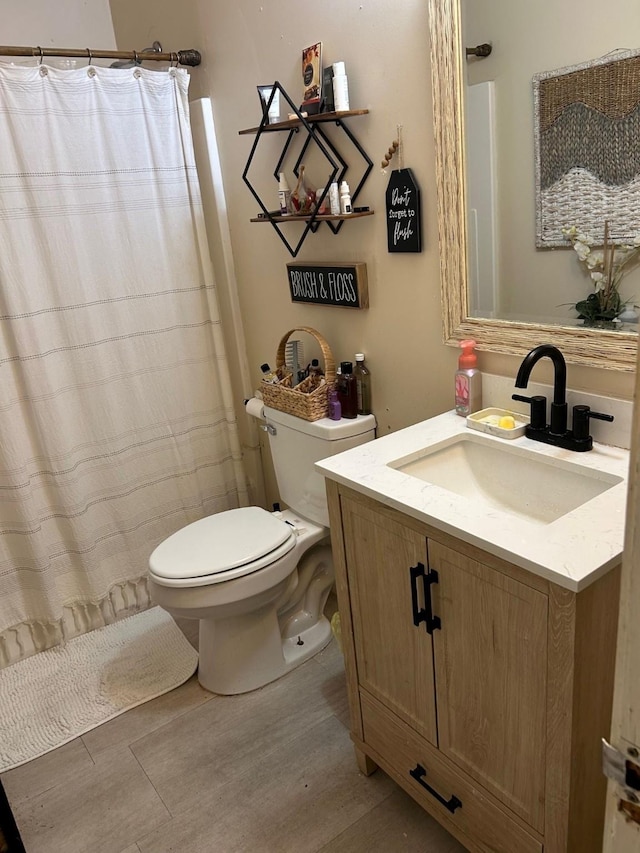 315 N Marsh Dr, Livingston, TX 77351 - full bathroom with wood finished floors, vanity, and curtained shower