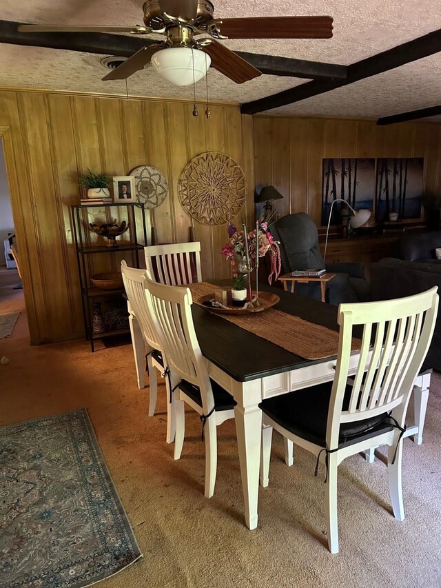 315 N Marsh Dr, Livingston, TX 77351 - carpeted dining space with wooden walls, ceiling fan, and a textured ceiling