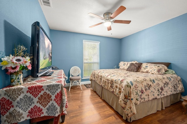 26145 Shadow Ln, New Caney, TX 77357 - bedroom with light wood-style floors and a ceiling fan