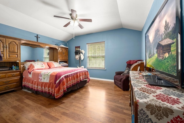 26145 Shadow Ln, New Caney, TX 77357 - bedroom with vaulted ceiling, wood finished floors, and ceiling fan