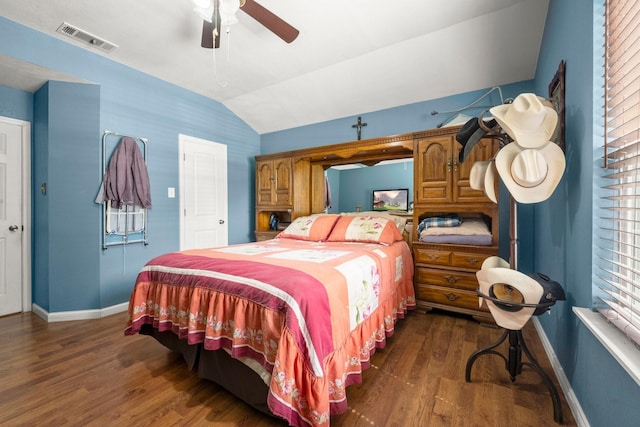 26145 Shadow Ln, New Caney, TX 77357 - bedroom with lofted ceiling, dark wood finished floors, and a ceiling fan