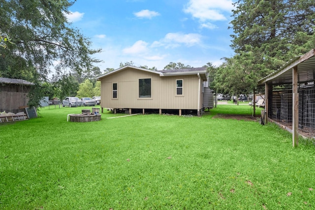 26145 Shadow Ln, New Caney, TX 77357 - rear view of house with a yard