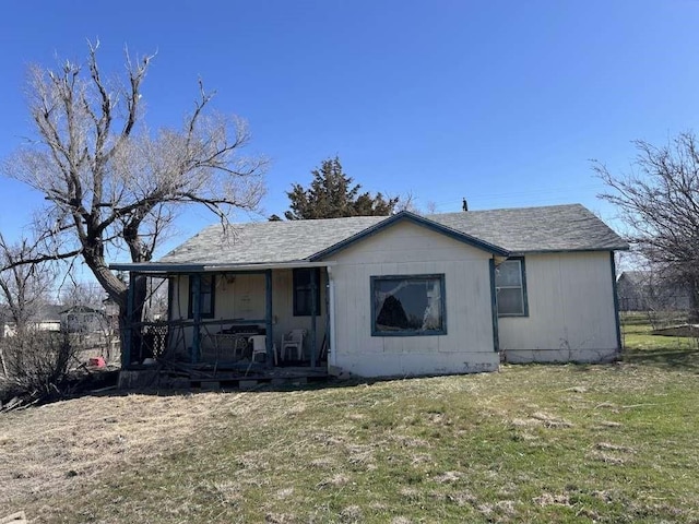 612 Hazel St, Pampa, TX 79065 - view of front of house with a porch, a front lawn, and roof with shingles