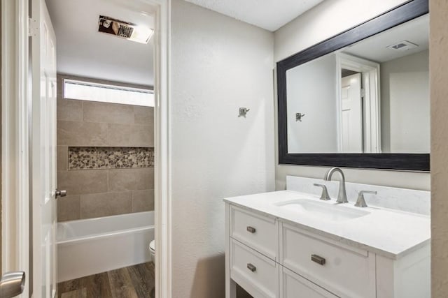 4710 N Cashel Cir, Houston, TX 77069 - bathroom featuring wood finished floors, vanity, and shower / bath combination