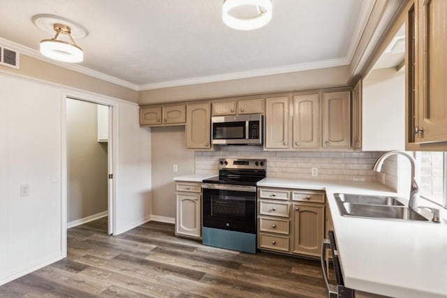 4710 N Cashel Cir, Houston, TX 77069 - kitchen featuring stainless steel appliances, light countertops, dark wood-style flooring, decorative backsplash, and crown molding