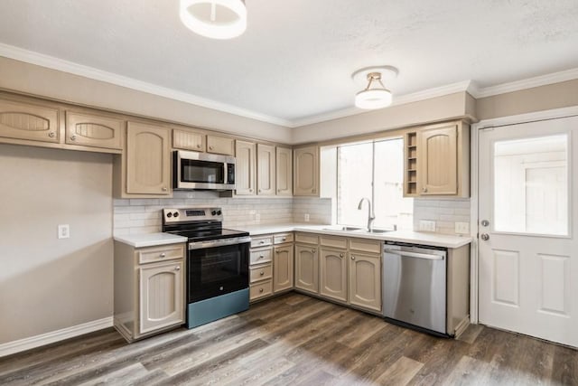 4710 N Cashel Cir, Houston, TX 77069 - kitchen featuring stainless steel appliances, light countertops, dark wood-style flooring, decorative backsplash, and ornamental molding