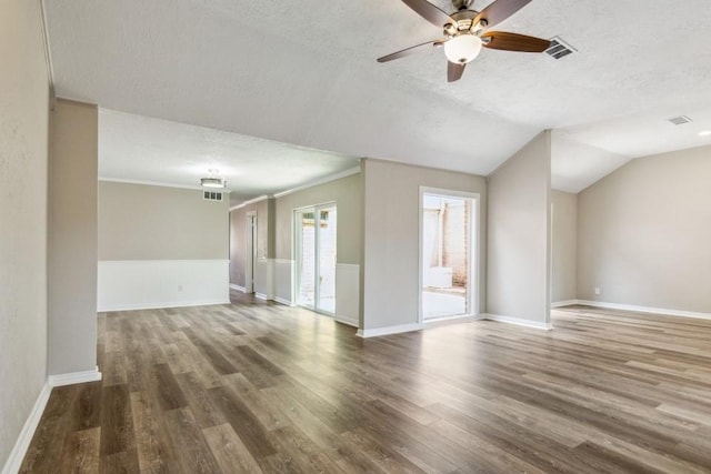 4710 N Cashel Cir, Houston, TX 77069 - unfurnished living room featuring a textured ceiling, wood finished floors, a ceiling fan, and ornamental molding