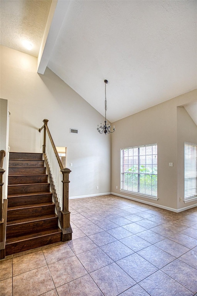 14715 Cobre Valley Dr, Houston, TX 77062 - unfurnished living room featuring beamed ceiling, stairs, a chandelier, a textured ceiling, and tile patterned floors