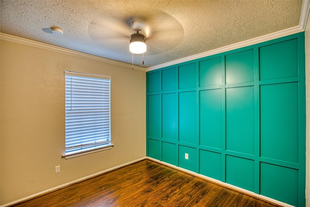 14715 Cobre Valley Dr, Houston, TX 77062 - unfurnished room with a textured ceiling, a ceiling fan, crown molding, dark wood-style floors, and a decorative wall