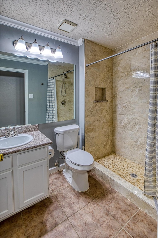 14715 Cobre Valley Dr, Houston, TX 77062 - full bath featuring vanity, a tile shower, tile patterned floors, a textured ceiling, and crown molding
