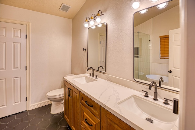 14715 Cobre Valley Dr, Houston, TX 77062 - full bath featuring tile patterned floors, double vanity, a shower with door, a textured wall, and a tub to relax in