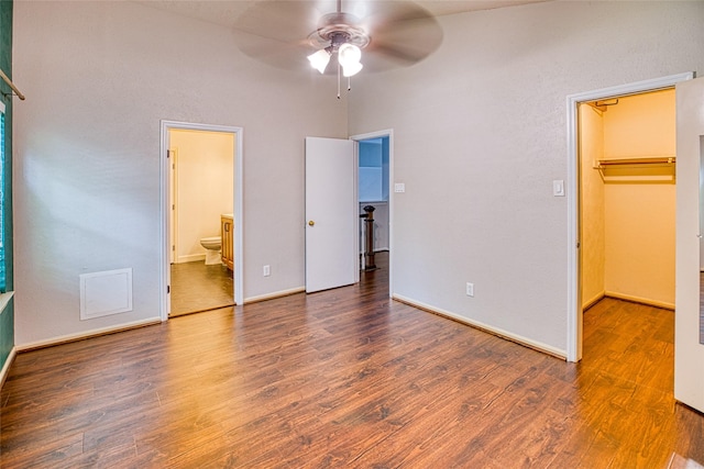 14715 Cobre Valley Dr, Houston, TX 77062 - unfurnished bedroom with a walk in closet, wood finished floors, a closet, and ensuite bath