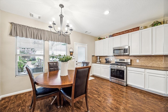29708 Parliament Hills Dr, Spring, TX 77386 - dining area featuring a chandelier and dark wood-style flooring