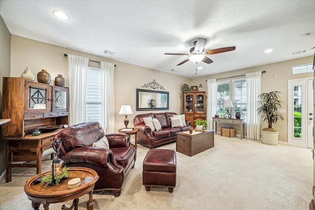 29708 Parliament Hills Dr, Spring, TX 77386 - carpeted living room with a ceiling fan, recessed lighting, and a textured ceiling