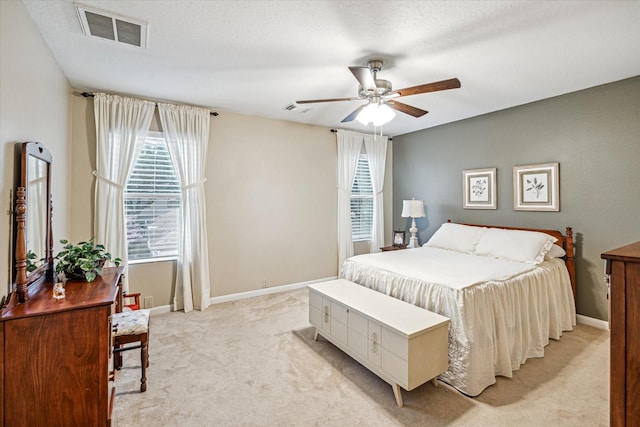 29708 Parliament Hills Dr, Spring, TX 77386 - bedroom with light colored carpet, multiple windows, and a ceiling fan