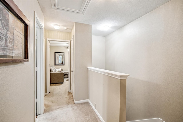 29708 Parliament Hills Dr, Spring, TX 77386 - hall featuring light carpet, an upstairs landing, and a textured ceiling