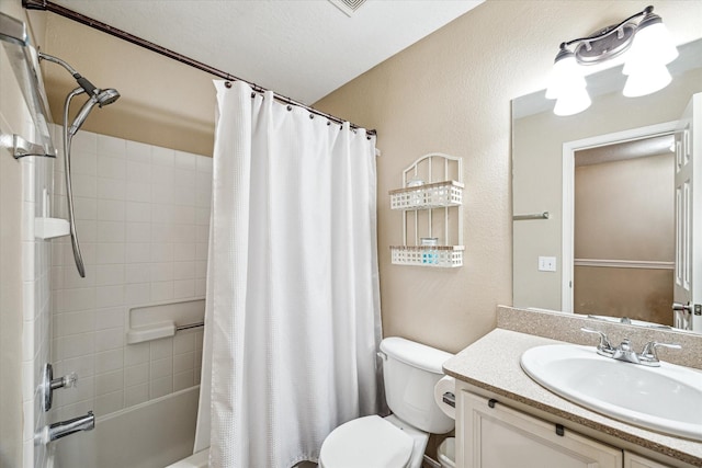 29708 Parliament Hills Dr, Spring, TX 77386 - bathroom featuring vanity, shower / bathtub combination with curtain, and a textured wall