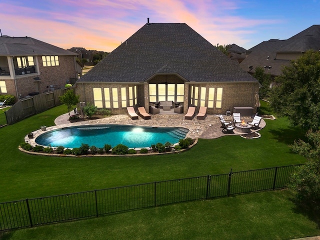 28106 Island Manor Ln, Fulshear, TX 77441 - pool at dusk with an outdoor living space with a fire pit, a fenced backyard, and a patio