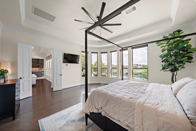 28106 Island Manor Ln, Fulshear, TX 77441 - bedroom featuring a raised ceiling, ornamental molding, dark wood-style flooring, and ceiling fan