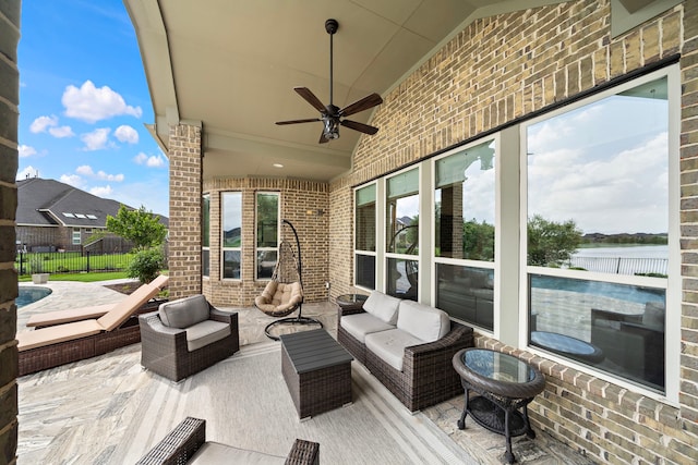 28106 Island Manor Ln, Fulshear, TX 77441 - view of patio / terrace with ceiling fan, an outdoor living space, and a water view