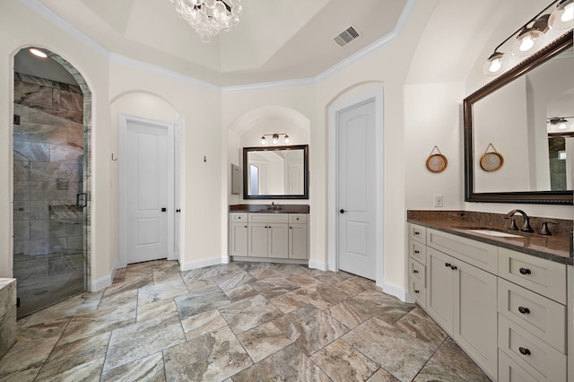 28106 Island Manor Ln, Fulshear, TX 77441 - full bath featuring crown molding, a stall shower, two vanities, stone finish floors, and a chandelier