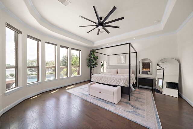 28106 Island Manor Ln, Fulshear, TX 77441 - bedroom featuring a raised ceiling, ornamental molding, dark wood-style flooring, and recessed lighting