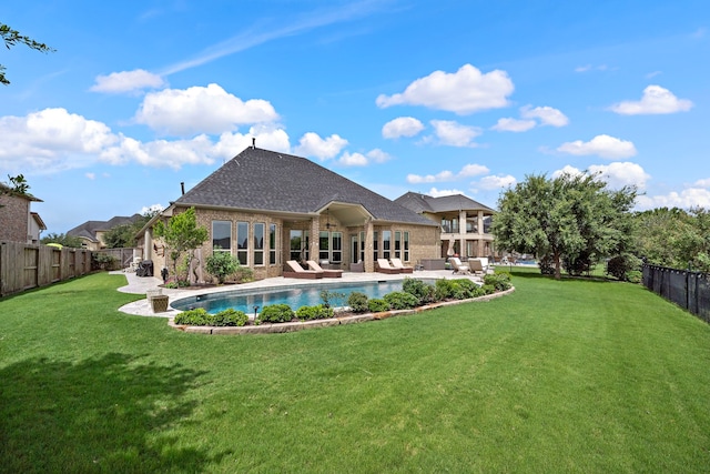 28106 Island Manor Ln, Fulshear, TX 77441 - rear view of house featuring an outdoor hangout area, brick siding, a fenced backyard, a patio, and roof with shingles