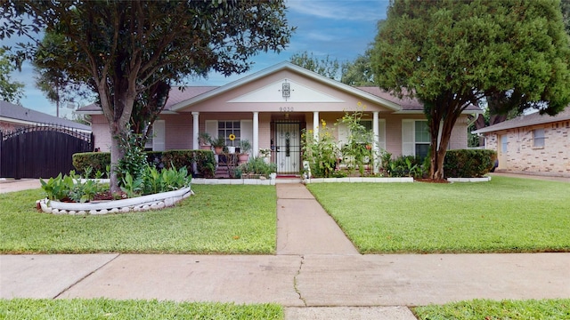 9030 Troulon Dr, Houston, TX 77036 - view of front of property featuring a porch and a front yard