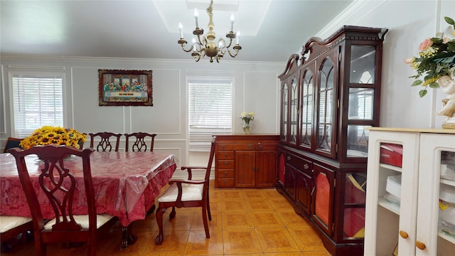 9030 Troulon Dr, Houston, TX 77036 - dining area with a chandelier, plenty of natural light, ornamental molding, a decorative wall, and light tile patterned floors