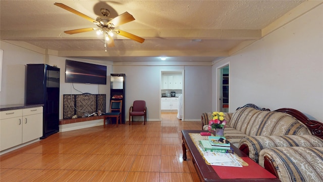 9030 Troulon Dr, Houston, TX 77036 - living room featuring a textured ceiling, beam ceiling, and a ceiling fan