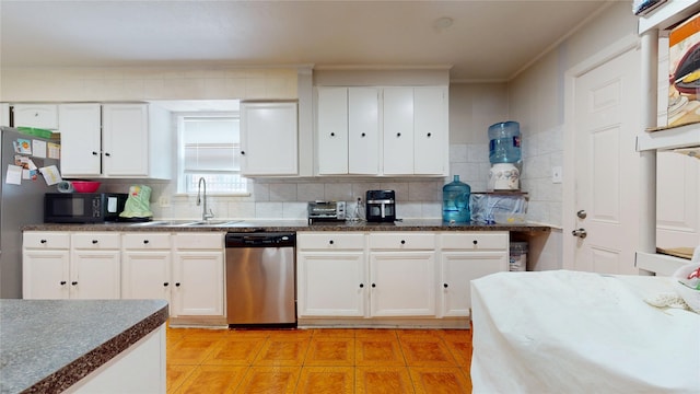 9030 Troulon Dr, Houston, TX 77036 - kitchen with dishwasher, black microwave, white cabinetry, light tile patterned floors, and ornamental molding