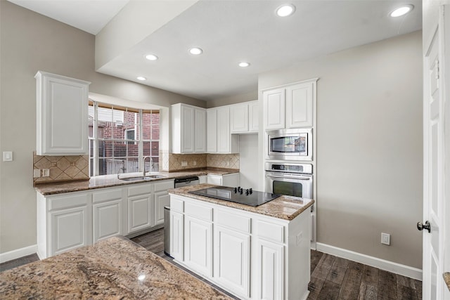 1123 Misty Lake Dr, Sugar Land, TX 77498 - kitchen featuring stainless steel appliances, decorative backsplash, light stone countertops, white cabinets, and recessed lighting
