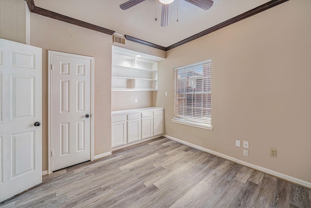 1123 Misty Lake Dr, Sugar Land, TX 77498 - empty room featuring ornamental molding, light wood-type flooring, and a ceiling fan