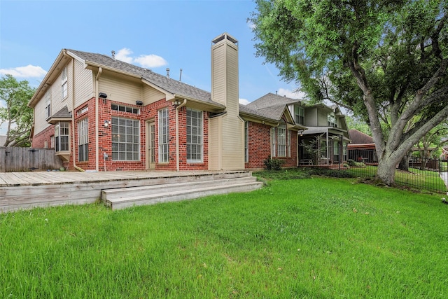 1123 Misty Lake Dr, Sugar Land, TX 77498 - back of property featuring brick siding, a chimney, a deck, and a shingled roof