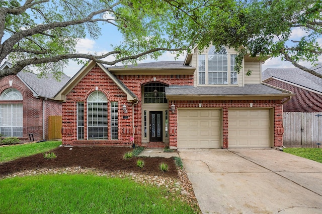 1123 Misty Lake Dr, Sugar Land, TX 77498 - view of front of house with concrete driveway, brick siding, an attached garage, and a shingled roof