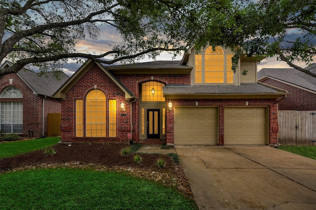 1123 Misty Lake Dr, Sugar Land, TX 77498 - view of front of home featuring brick siding, concrete driveway, a garage, and roof with shingles