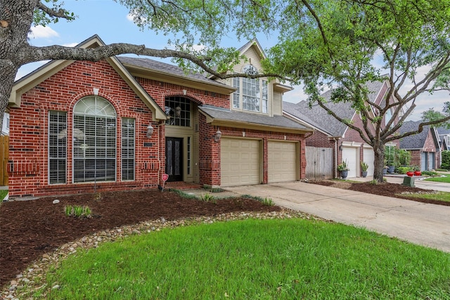 1123 Misty Lake Dr, Sugar Land, TX 77498 - traditional-style home featuring concrete driveway, a garage, brick siding, and a shingled roof
